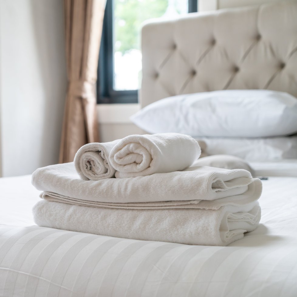 shower towel on bed